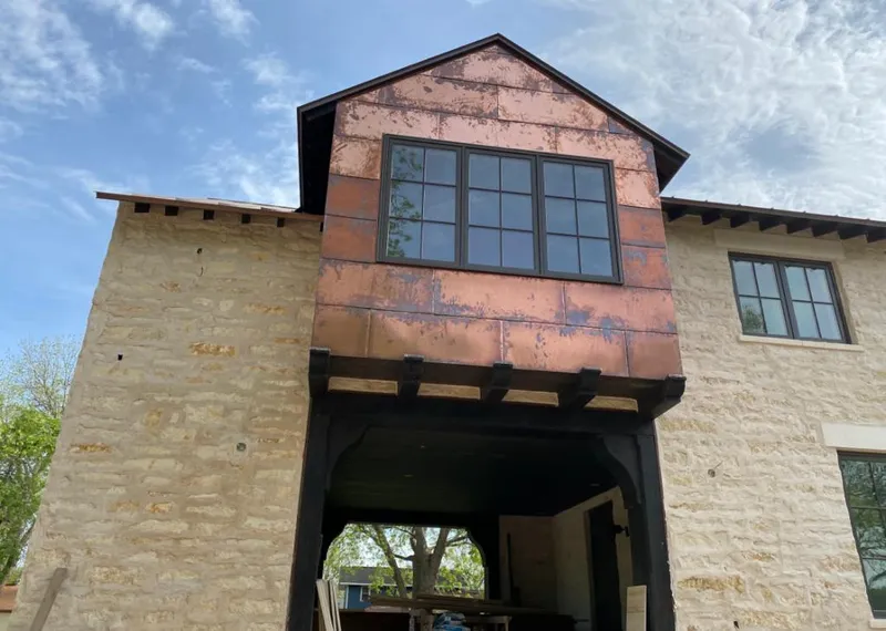 Copper metal panel facade on a stone building for Roof Repair in Harrodsburg